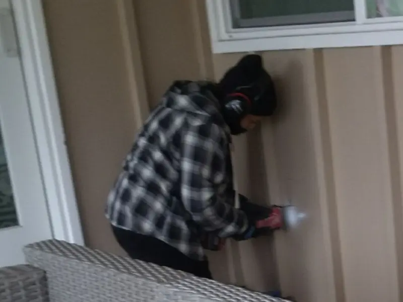 Professional electrician installing an exterior outlet in Green Bay