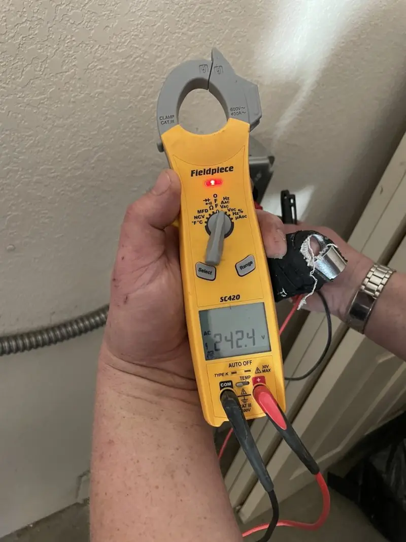 Voltage testing with clamp meter during Outlet Installation in Green Bay